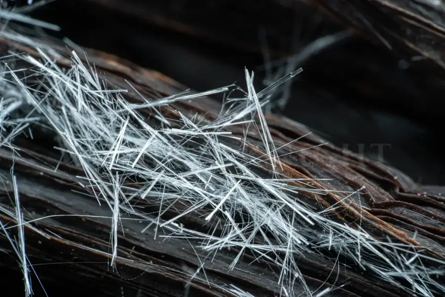 Macro detail of natural vanillin crystals formed on the surface of a cured vanilla pod