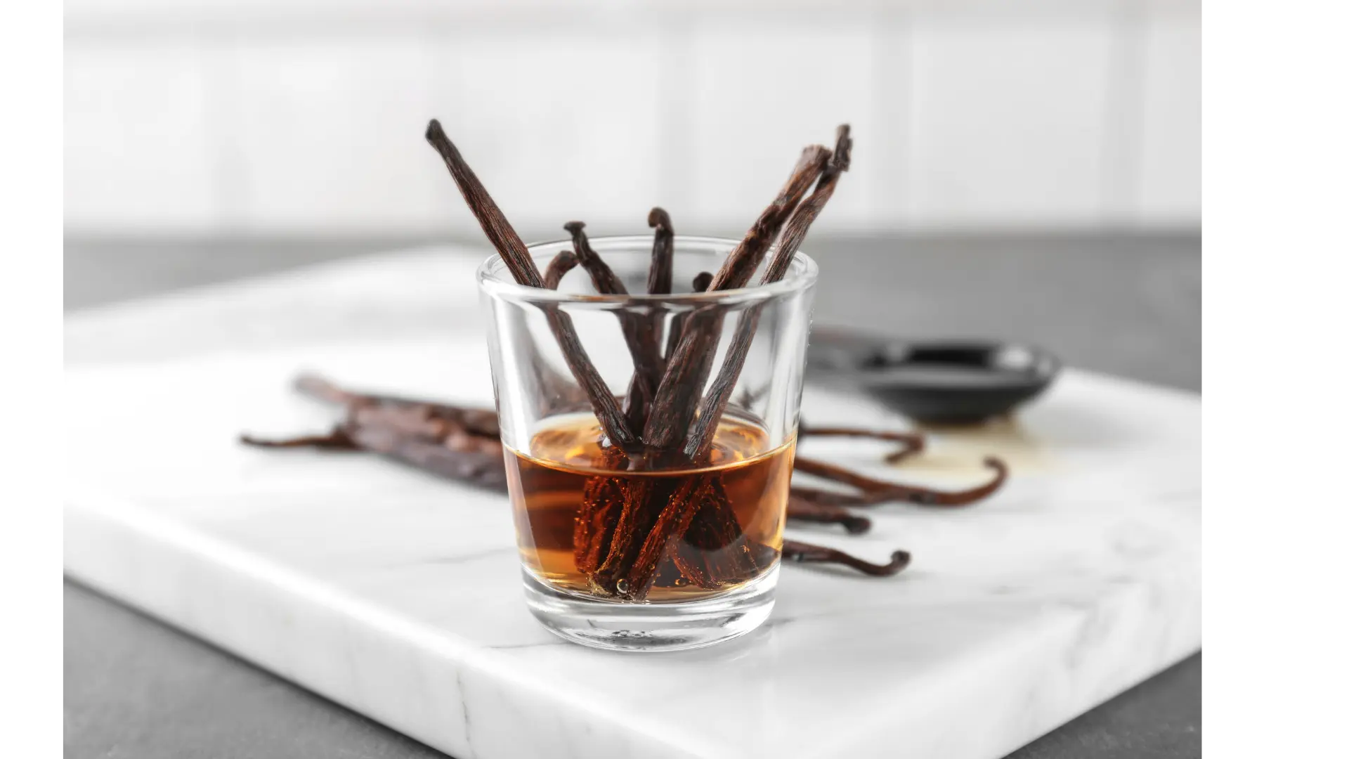 Alcohol-free vanilla extract shown in a glass, clear to light brown in colour