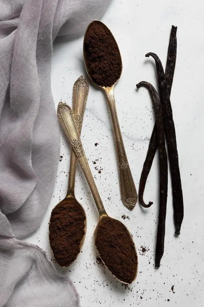 Close-up of fine vanilla powder texture milled from dried vanilla beans